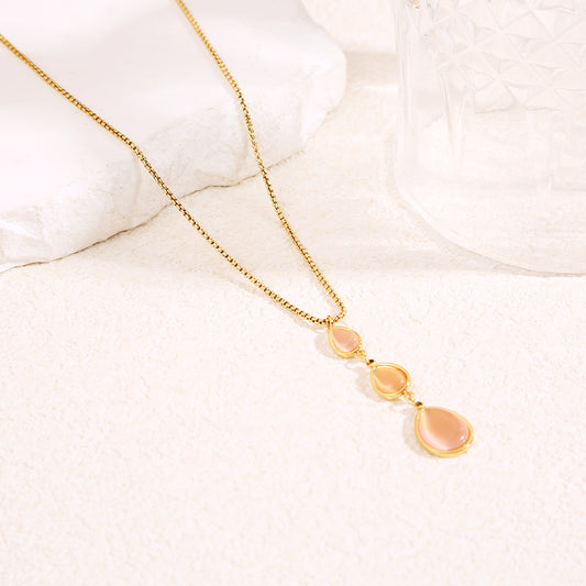 Collier chaîne dorée en Y avec pierres œil de chat rose