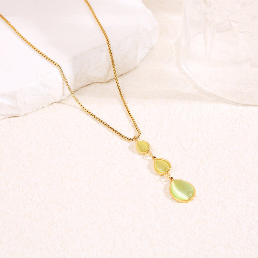 Collier chaîne dorée en Y avec pierres œil de chat vert