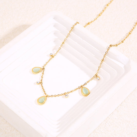 Collier chaîne dorée avec strass et 3 gouttes œil de chat bleu