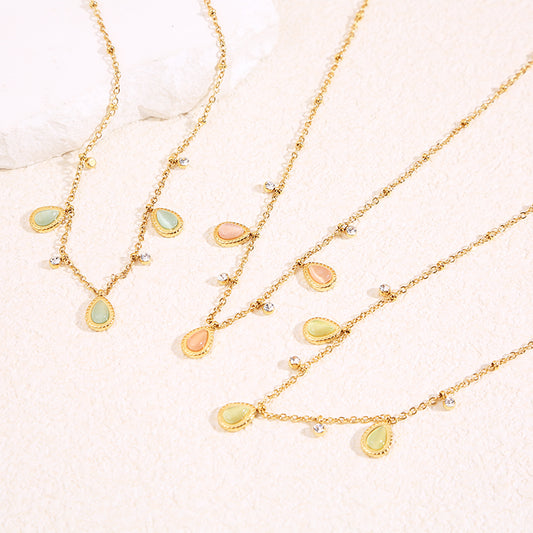 Collier chaîne dorée avec strass et 3 gouttes œil de chat bleu