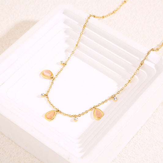 Collier chaîne dorée avec strass et 3 gouttes œil de chat rose