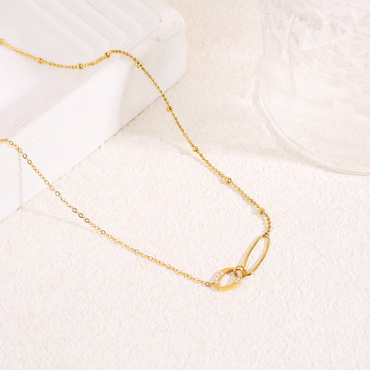 Collier chaîne fine dorée avec 2 pendentifs ovals ajouré fine et épaisse avec strass