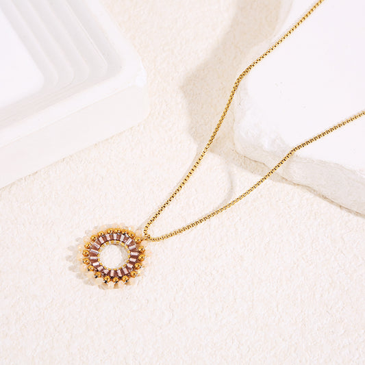 Collier doré chaîne fine avec pendentif rond perlé