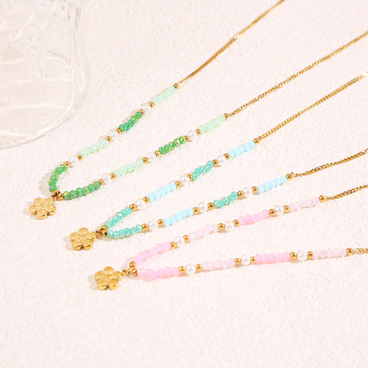 Collier doré cristaux roses pendentif fleur