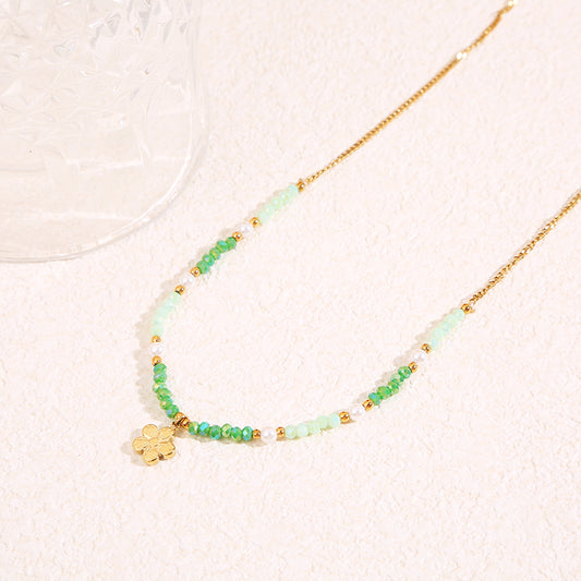 Collier doré cristaux verts pendentif fleur