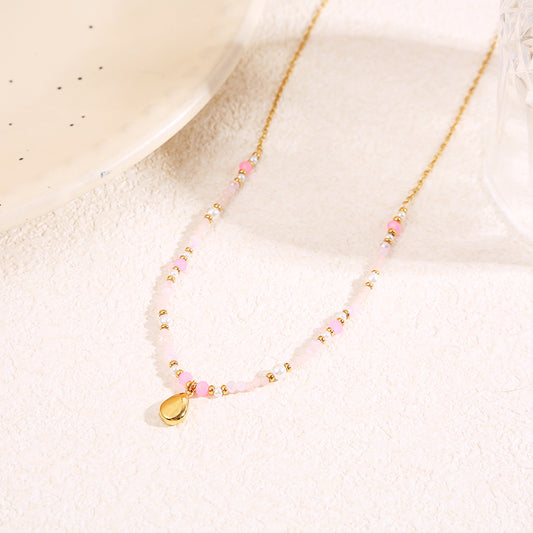 Collier doré cristaux roses pendentif goutte