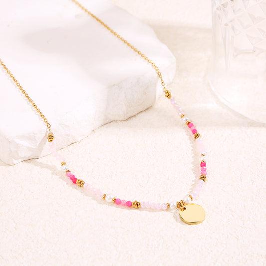 Collier doré cristaux roses pendentif plaque ronde