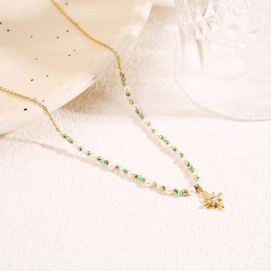 Collier doré cristaux bleus pendentif étoile strass