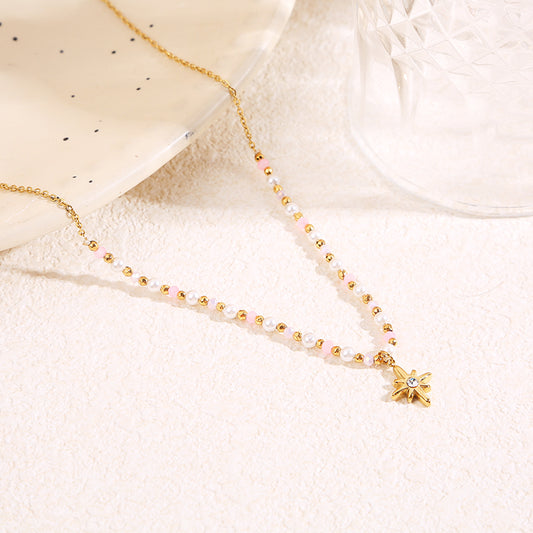 Collier doré cristaux roses pendentif étoile strass