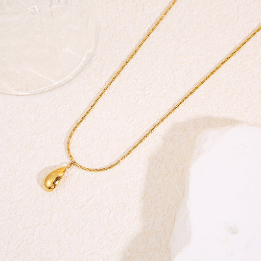 Collier chaîne serpent fine dorée avec pendentif goutte allongée effet miroir