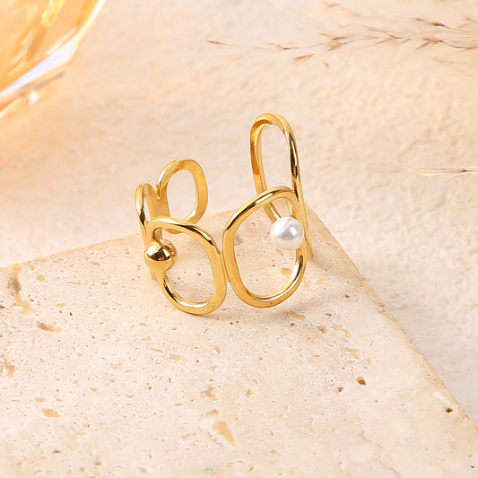 Bague dorée ajustable ornée d'anneaux ovales avec détails perle et doré