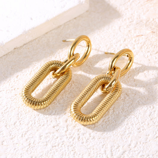 Boucles d'oreilles dorées pendantes châines texturés