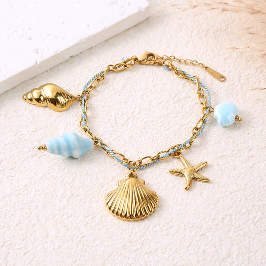 Bracelet chaîne dorée cordon bleu ciel charms coquillages bleu
