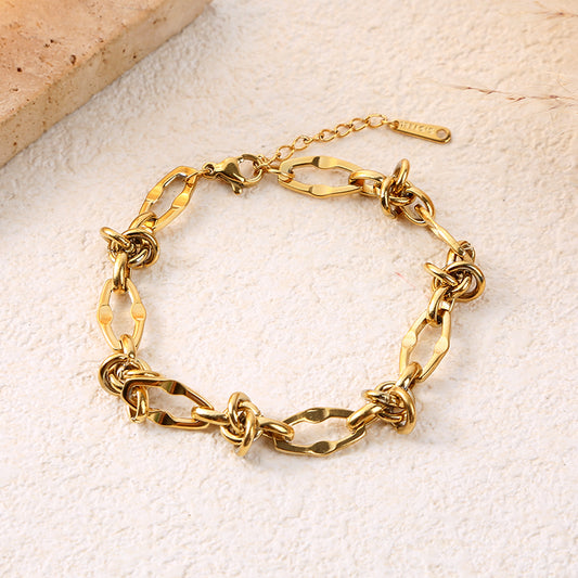 Bracelet chaîne ovales dorées avec nœuds d'anneaux