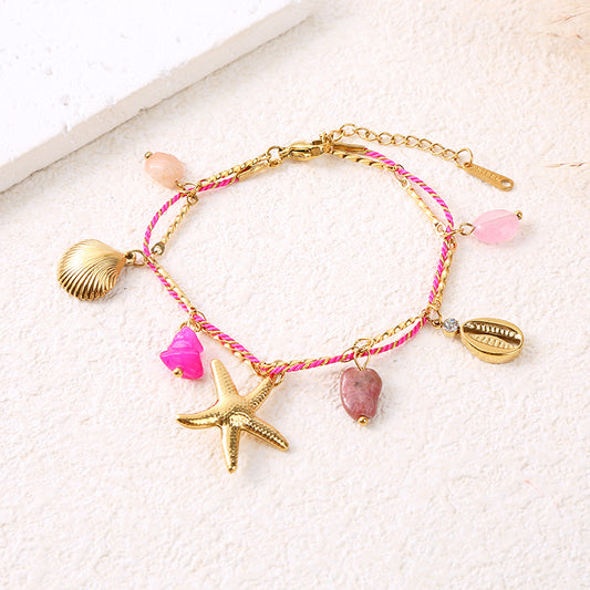 Bracelet chaîne dorée cordon rose charms étoile de mer et pierre rose