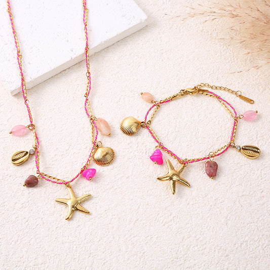 Bracelet chaîne dorée cordon rose charms étoile de mer et pierre rose