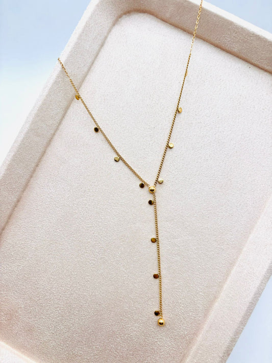 Collier doré avec mini pastilles en Y