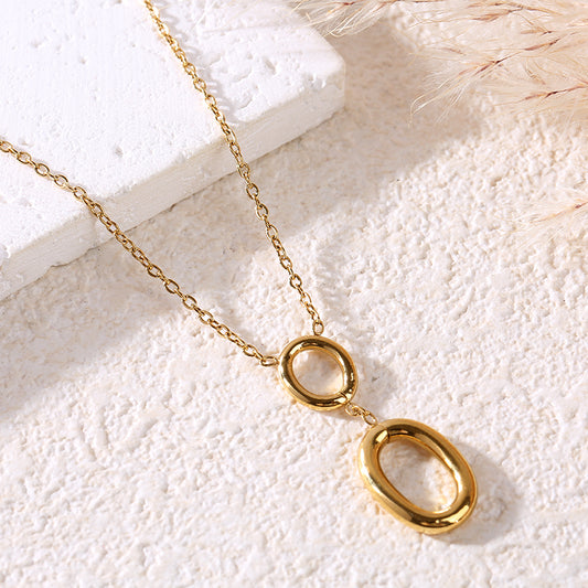 Collier chaîne dorée avec 2 anneaux ovales alignés verticalement