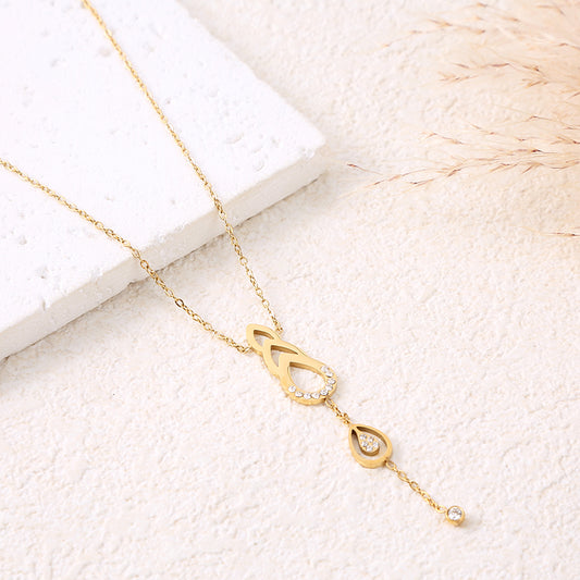 Collier chaîne dorée pendentifs avec gouttes ajourés et strass