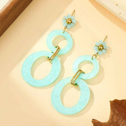 Boucles d'oreilles Pendantes Résine Bleue à Maillons Ovales et Fleur Perlée