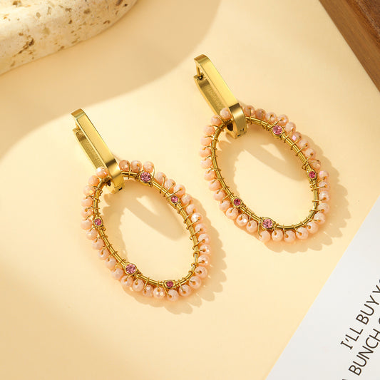 Boucles d'oreilles Créoles Dorées Ovale Tissé de Pierres Roses et Strass