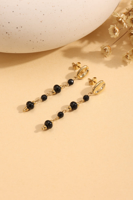 Boucles d'Oreilles Pendantes Dorées Avec Pierres Noires Et Attache Martelée