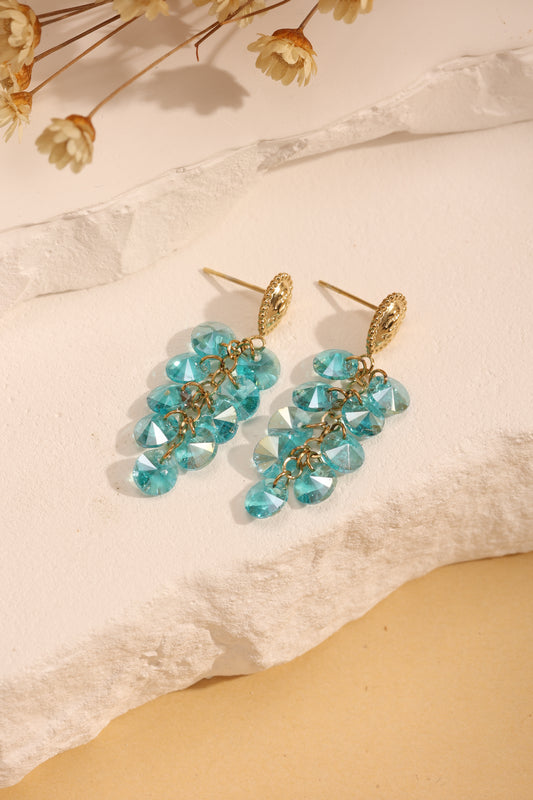 Boucles d'Oreilles Dorées Pendantes Avec Pampilles En Cristaux Bleues Et Attache Goutte Gravée