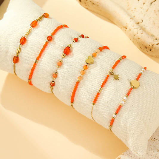 Lot de 6 Bracelets Dorés Perles Oranges Chams Cœur et Étoile Brillante