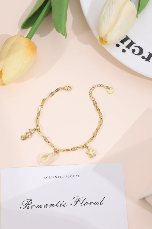 Bracelet maillons plats charms marins hippocampe coquillage tortue