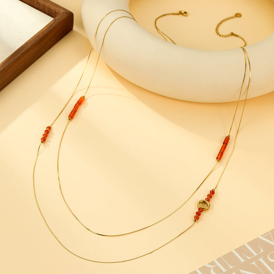 Collier Sautoir Double Chaîne Fils Fins Avec Perles Rouges et Anneau Central