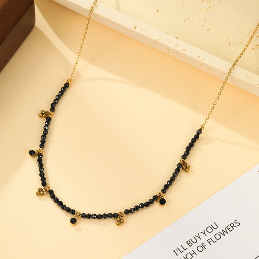 Collier Doré Perles Facettées Noires et Pendentifs Trèfle