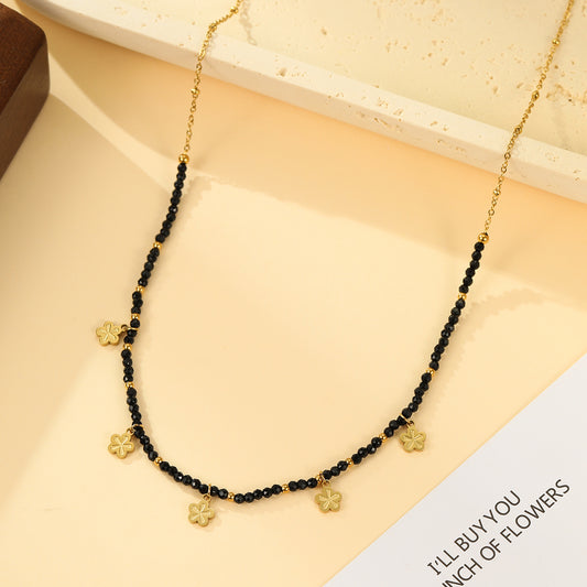 Collier Doré Perles Facettées Noires et Pendentifs Fleur