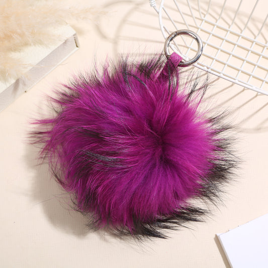 Porte clef boule de fourrure violet et noir