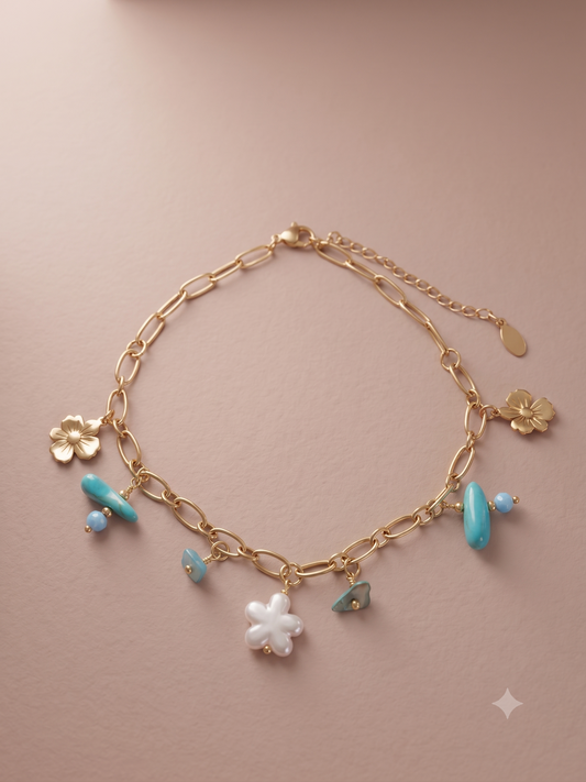 Chaîne de cheville dorée florale avec pierres et perles bleues