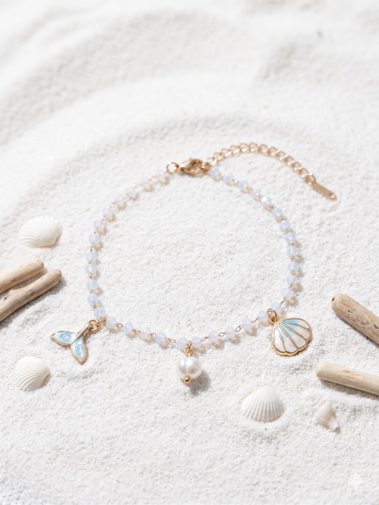 Chaîne de cheville dorée à perles, coquillage et queue de sirène