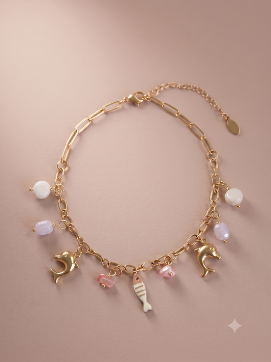 Chaîne de cheville dorée breloques dauphins, poisson et perles