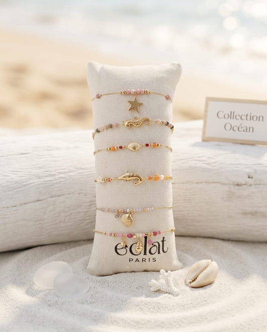 Lot de 6 bracelets dorés thème mer sur coussin
