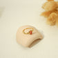 Golden ring with pink stone