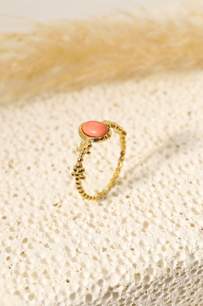 Golden ring with pink stone