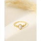 Golden ring with pink stone