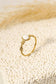 Golden ring with pink stone