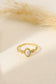 Golden ring with pink stone