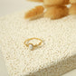 Golden ring with pink stone