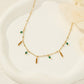 Necklace with pendants and green beads