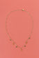 Necklace with pendants and green beads