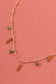 Necklace with pendants and green beads