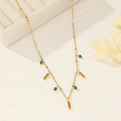 Necklace with pendants and green beads