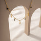Necklace with pendants and green beads