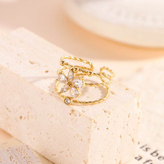 Bague ajustable à trois anneaux avec fleur strassée