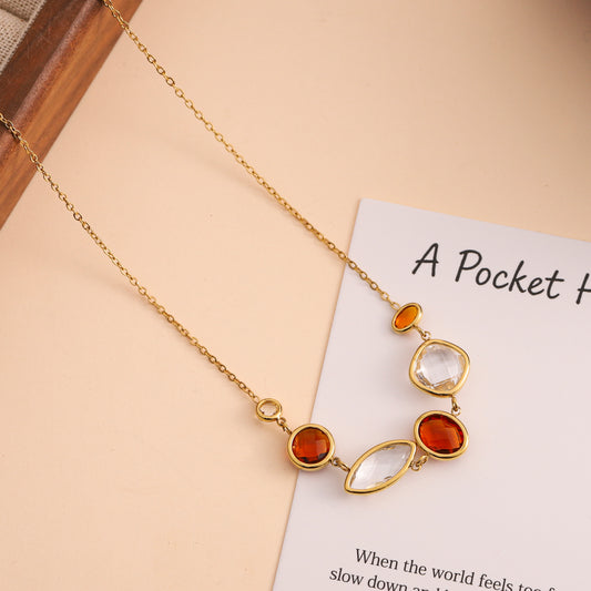 Collier doré à pierres facettées blanches et ambrées